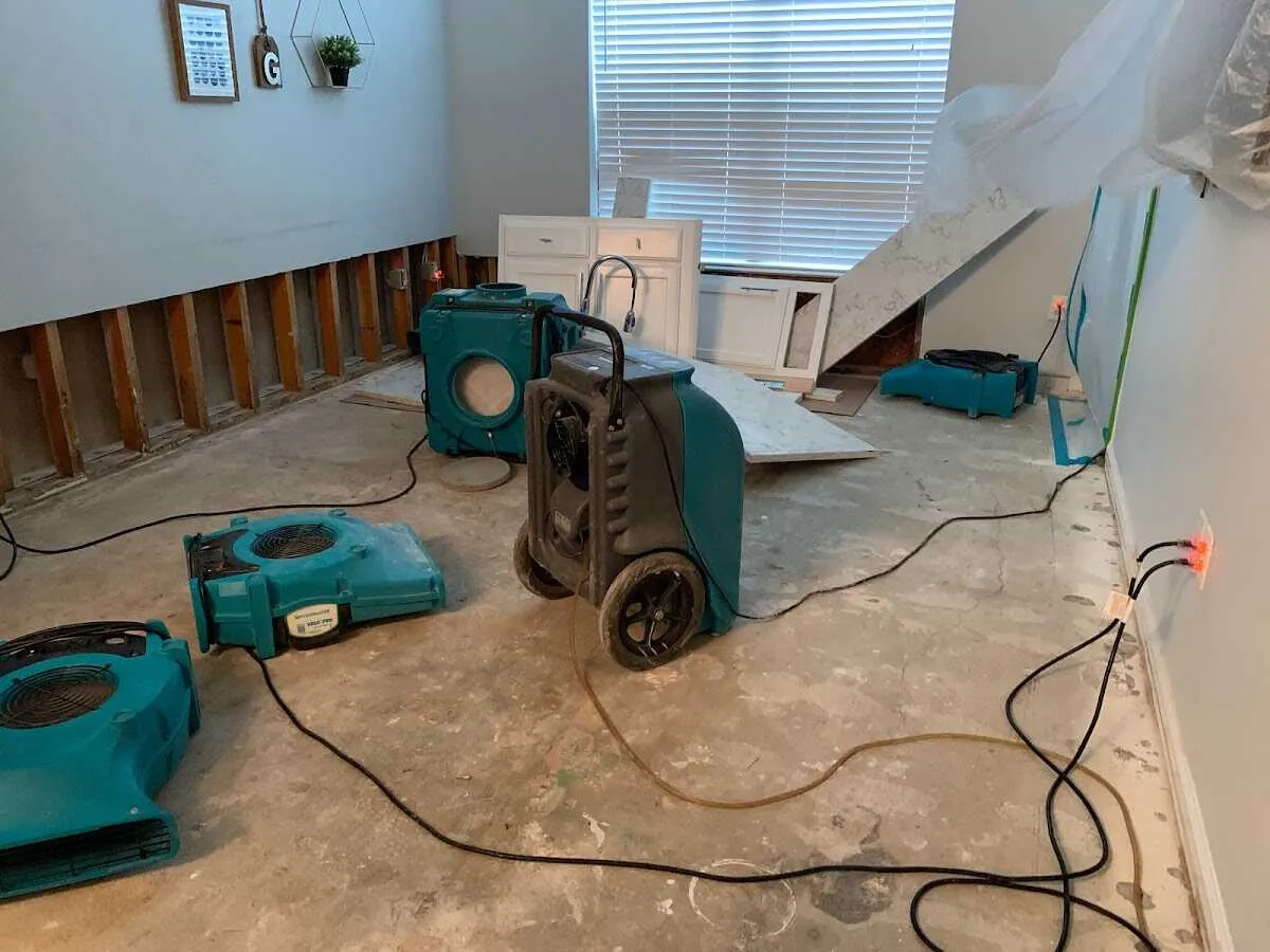 Dehumidifier in flood-cut room for Water Damage Restoration in Gaines